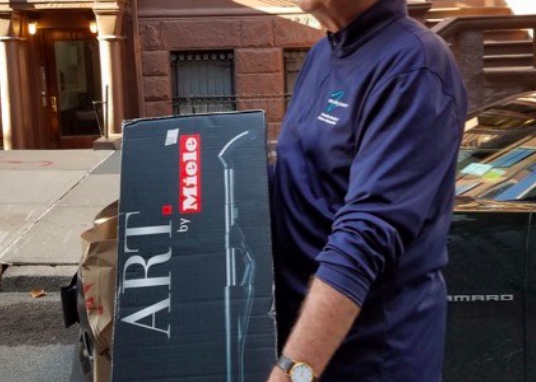 Jeff Howitt, Yard Sale chief organizer, with Silent Auction item