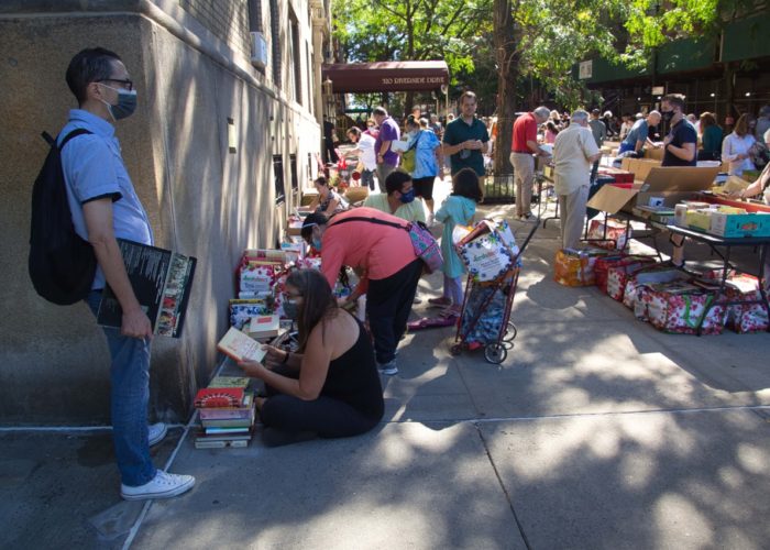 Browsing the Books - 2021 Yard Sale (photo by Barbara Boynton)