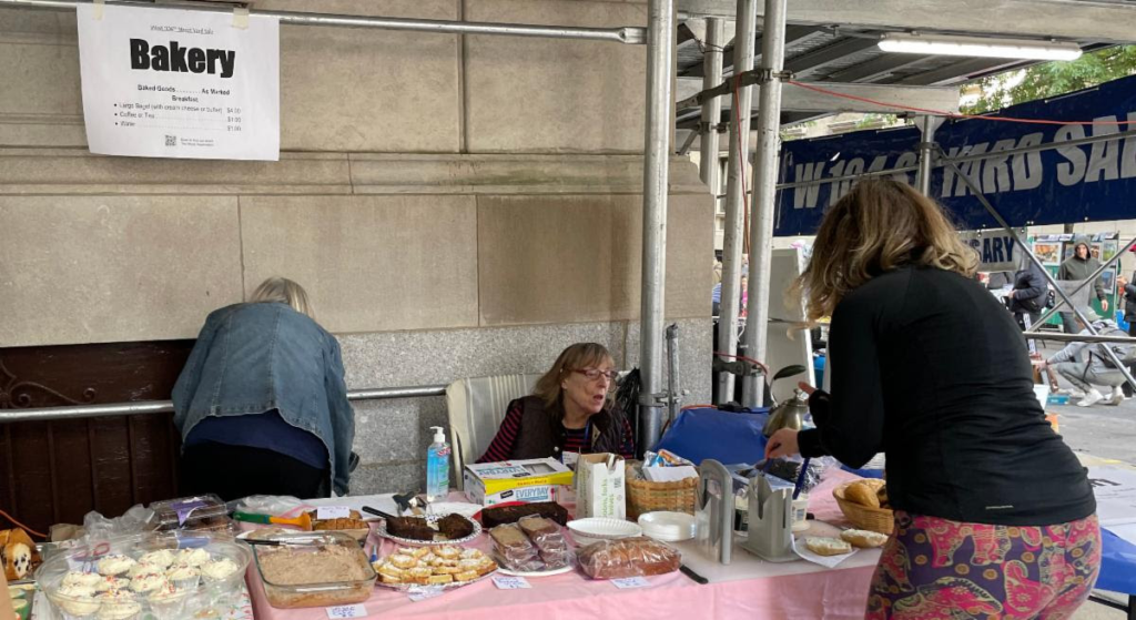 Block visitors peruse the bake sale goodies