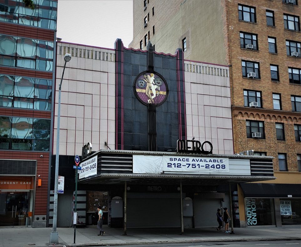 Marquee and art deco facade of the Metro Theater on Broadway! Featuring figures and masks representing comedia and tragedia.