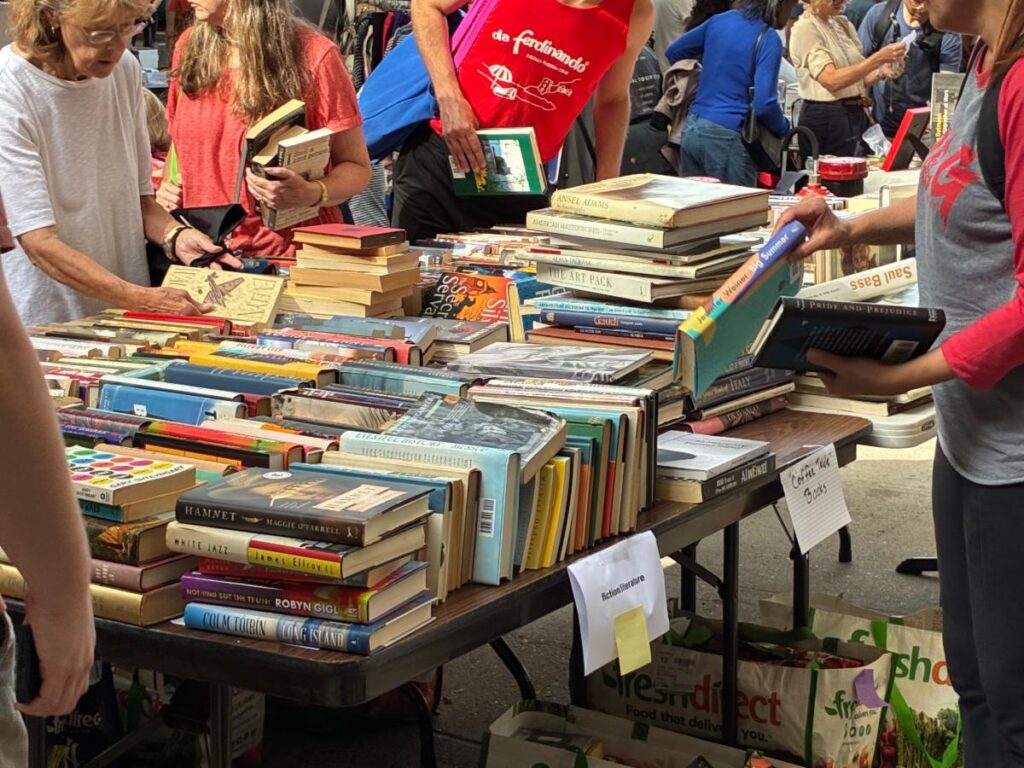 People browsing at a table of books