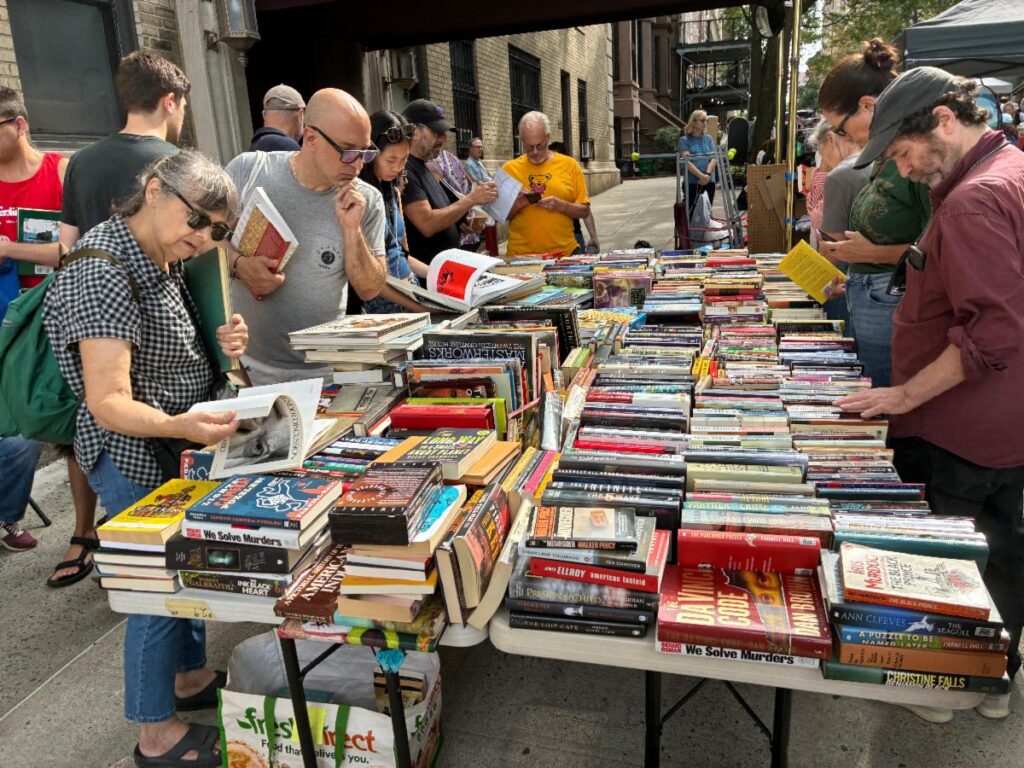 People browsing at a table of books