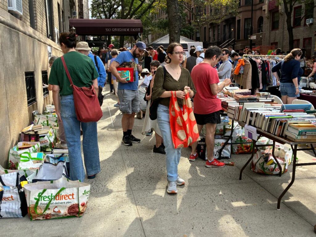 People browsing at a table of books